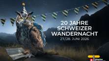Owl wearing a backpack and party hat in a mountain night landscape promoting Swiss Hiking Night 2026