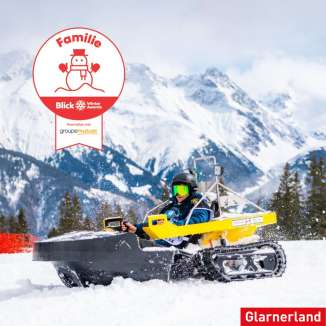 Logo of the Blick Winter Awards with someone driving a bobsla in the snow in the background and red font and the Logo and which category they are in.