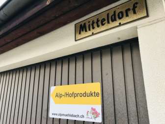 The signpost shows the way to the alpine cheese