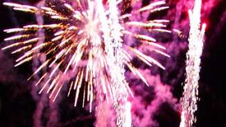 Close up picture of a firework colorfully exploding in the air.